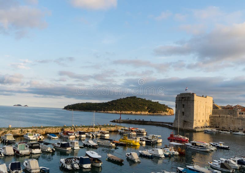 Dubrovnik / Croatia : Sailing boats at Saint John Fortress and the Old port in the Adriatic Sea in Dubrovnik, Croatia