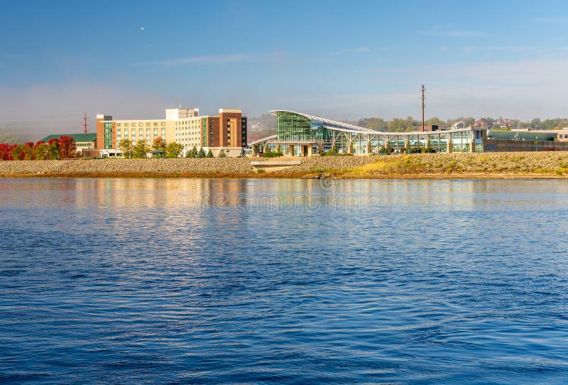 Casino hotel and convention center by Upper Mississippi on calm misty morning at Dubuque Iowa. Casino hotel and convention center by Upper Mississippi on calm misty morning at Dubuque Iowa