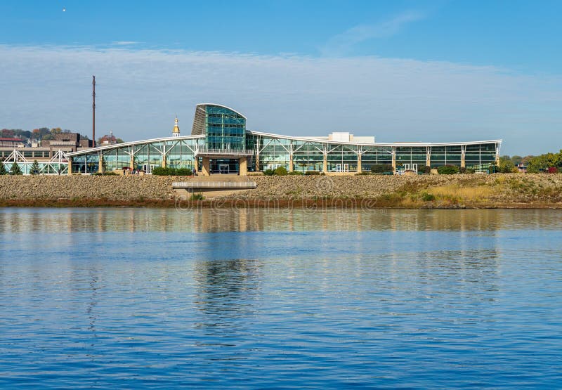 Casino hotel and convention center by Upper Mississippi on calm misty morning at Dubuque Iowa. Casino hotel and convention center by Upper Mississippi on calm misty morning at Dubuque Iowa