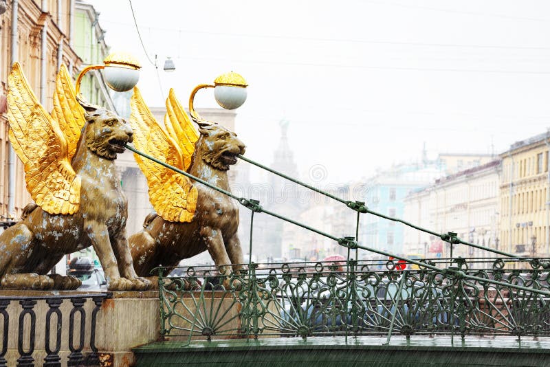 Two Griffins on Bank bridge crossing the Griboedov Canal near the former Banking Assignation in Saint Petersburg, Russia. Two Griffins on Bank bridge crossing the Griboedov Canal near the former Banking Assignation in Saint Petersburg, Russia