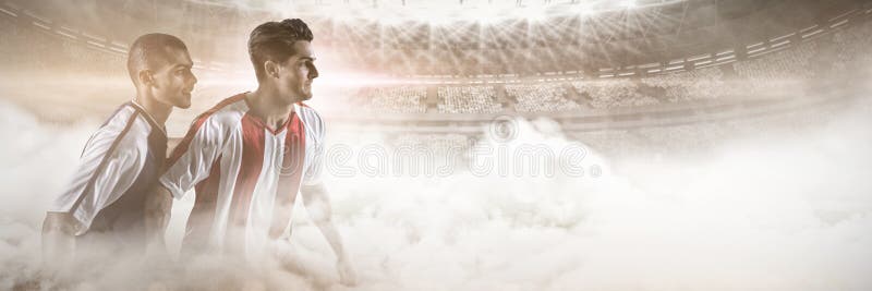 Due giocatori di football americano che si difendono mentre giocando a calcio contro l'immagine grafica dello stadio alla d fotografia stock libera da diritti Due giocatori di football americano che si difendono mentre giocando a calcio contro l'immagine grafica dello stadio alla d fotografia stock libera da diritti