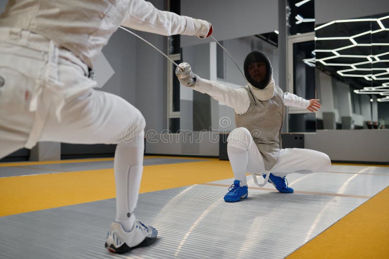 Swordsman Standing in Fencing Lunge during Training Fight in Fencer