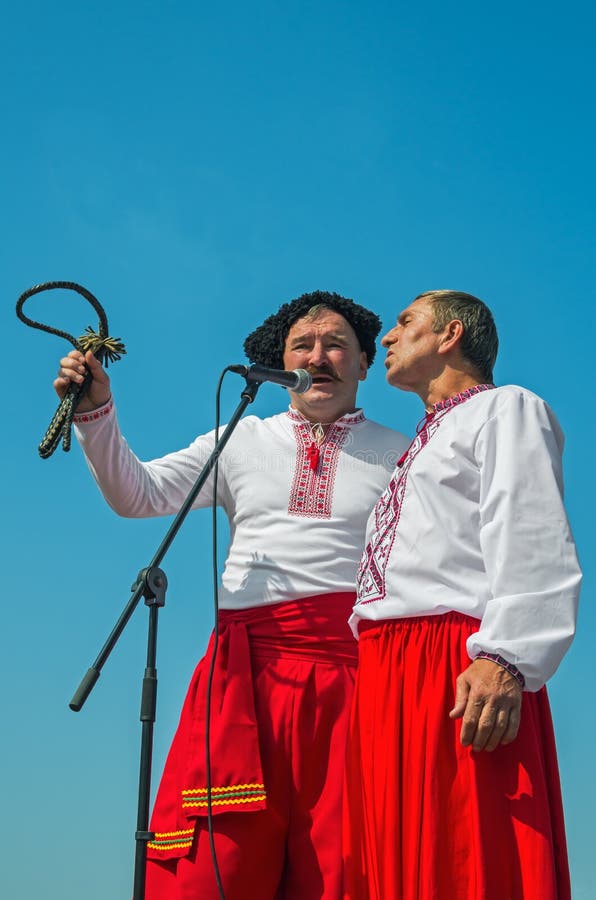 Dnipro, Ukraine - September 13, 2014: Ukrainian folklore male duet at festival in honor of City day. Dnipro, Ukraine - September 13, 2014: Ukrainian folklore male duet at festival in honor of City day