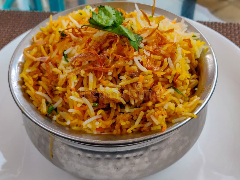 Dum Biryani served in a steel pot. Chicken dum biryani stock images, royalty-free photos and pictures
