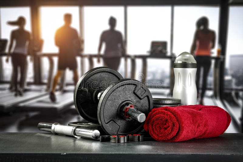 Dumbbell, Barbell and Workout in the Gym. Glass Table Top with Empty Space  with Blurred Gym Background. Stock Photo - Image of heavy, barbell:  161109464