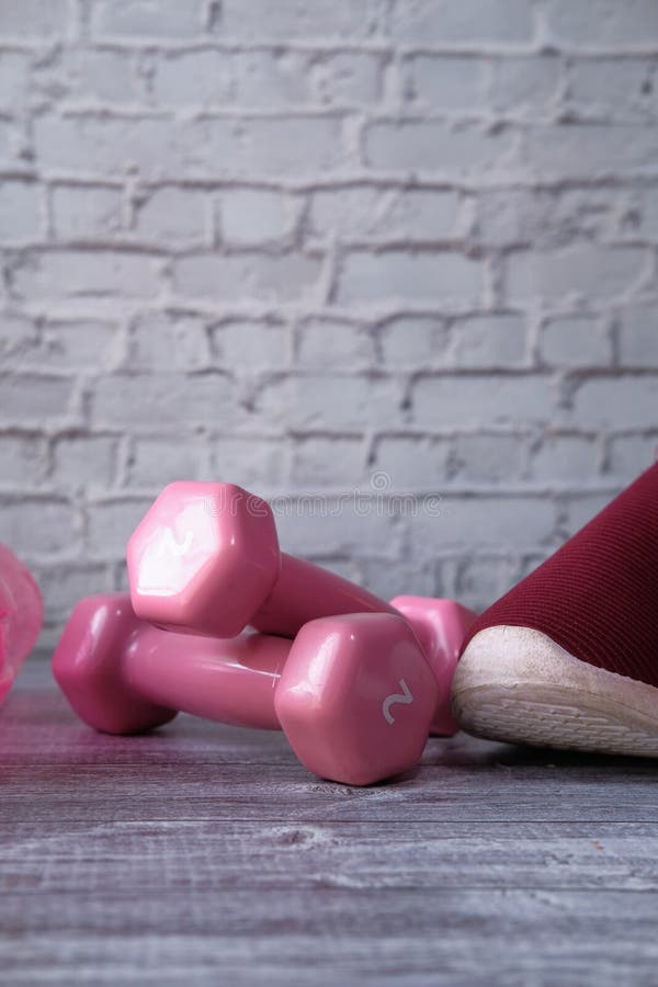 Dumbbell, Shoe and Exercise Mat Floor with Copy Space Stock Image