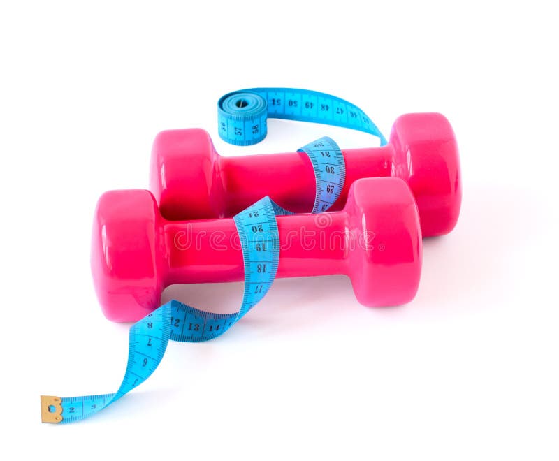 Dumbbells cor-de-rosa e medidor azul foto de stock royalty free Dumbbells cor-de-rosa e medidor azul foto de stock royalty free