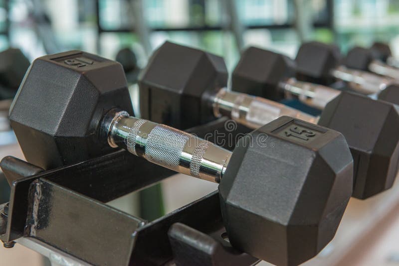 dumbbells in the gym at sports club for exercise and Bodybuildin