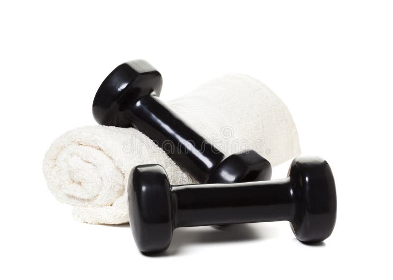 Dumbbells i ręcznik odizolowywający na bielu obrazy royalty free Dumbbells i ręcznik odizolowywający na bielu obrazy royalty free