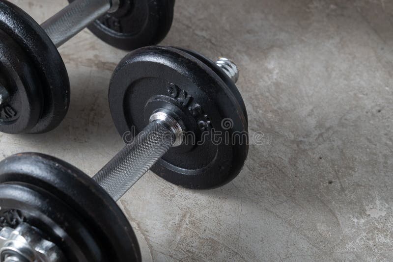 Manuscript stopverf meerderheid Dumbbells for Muscle Building Exercise Placed on Cement Floor with  Copyspace.Body Workout in the Gym Training Concept Stock Image - Image of  indoor, fitness: 183562017