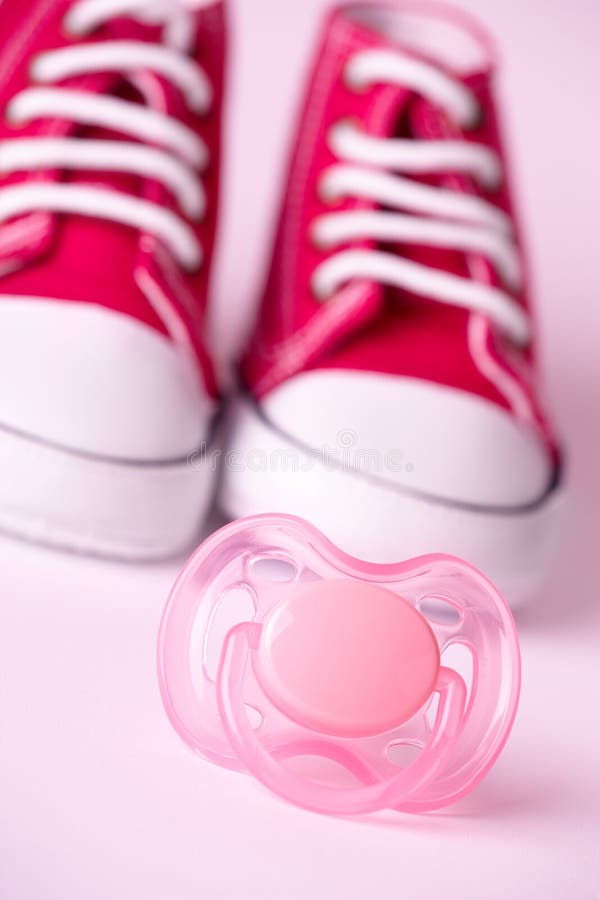 Dummy and baby shoes stock image
