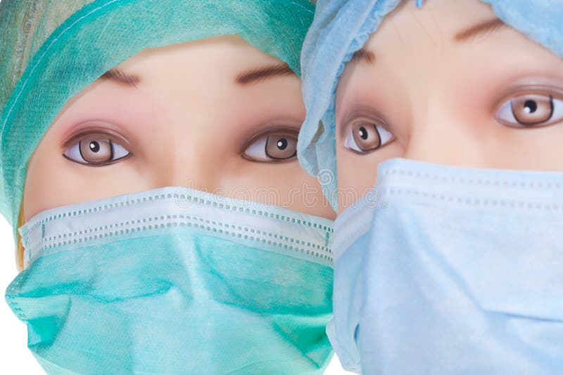 Dummy Doctor Heads Wearing Textile Surgical Cap and Mask Stock Image