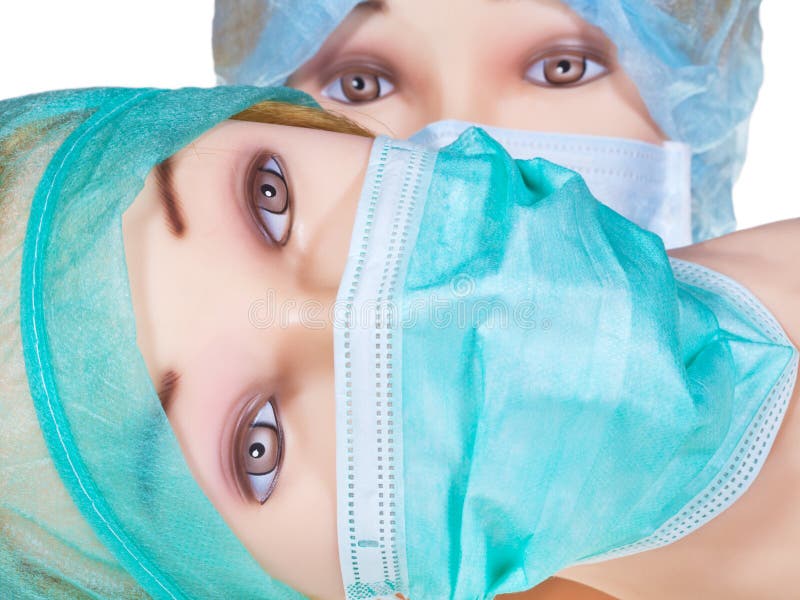 Dummy Doctor Heads Wearing Textile Surgical Cap and Mask Stock Image