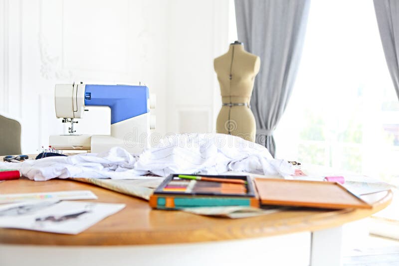 Dummy and other sewing equipment in the desighners workplace royalty free stock photo