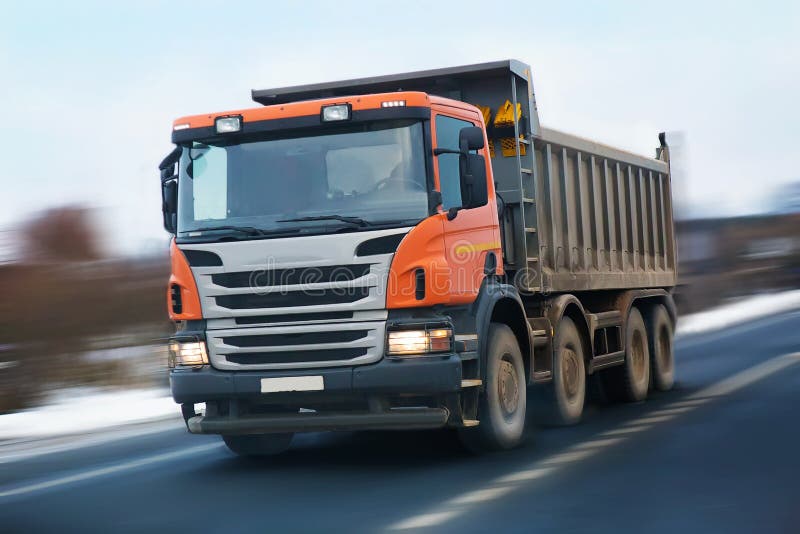 Dump truck with an orange cabin