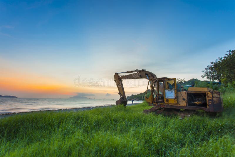 Dump truck at sunset along the beach