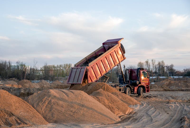 Dump Truck Unloading Earth Sand for Road Construction or for Foundation
