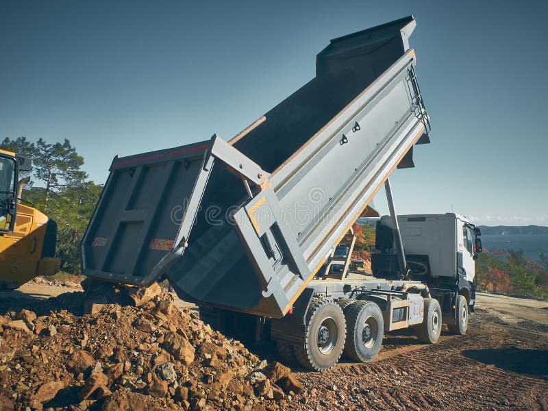 Dump Truck Unloads Soil from Truck Back Stock Photo Image of ground