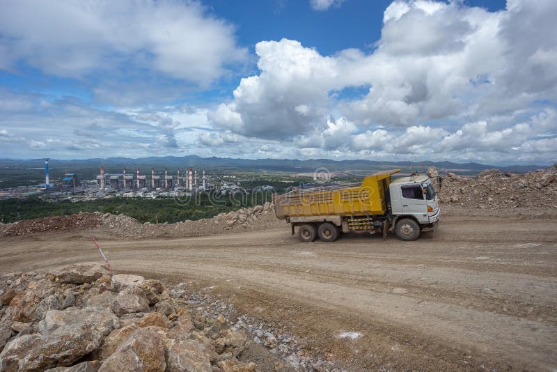 Dumper truck carrying rocks in a quarry. Dumper truck carrying rocks in a quarry