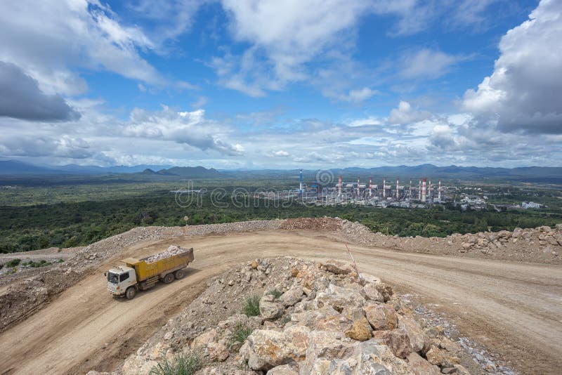 Dumper truck carrying rocks in a quarry. Dumper truck carrying rocks in a quarry