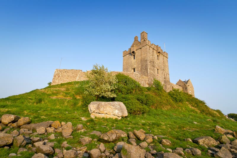 Dunguaire castle on green hill stock images