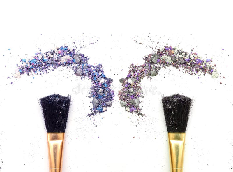 Duo makeup brush with mixed color eyeshadow powder.