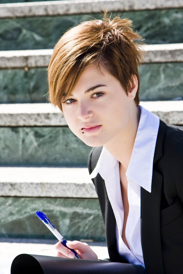 Short haired businesswoman staring at camera. Short haired businesswoman staring at camera.