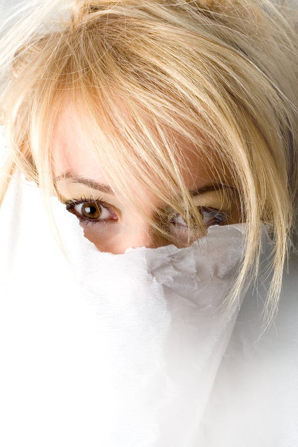 Woman's head coming out of white background. Woman's head coming out of white background