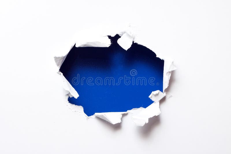 Breakthrough paper hole with blue textured background. Breakthrough paper hole with blue textured background.