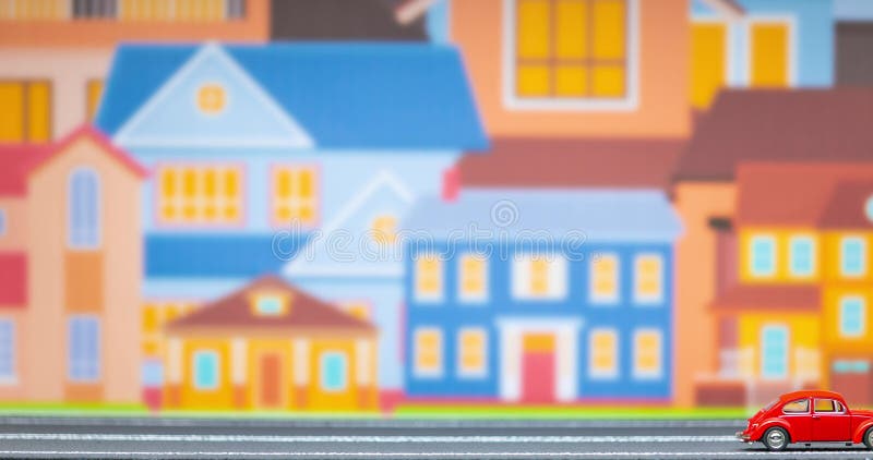 Durée d'un jouet rouge simple de voitures se déplaçant de la gauche pour redresser sur un modèle de route avec un groupe de maison banque de vidéos