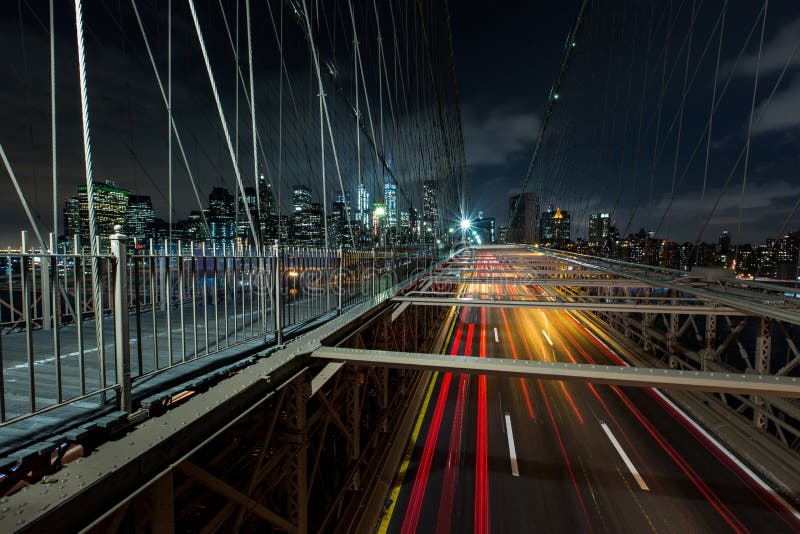 Dusk Busy Traffic Over Brooklyn Bridge with Lower Manhattan Skyline ...
