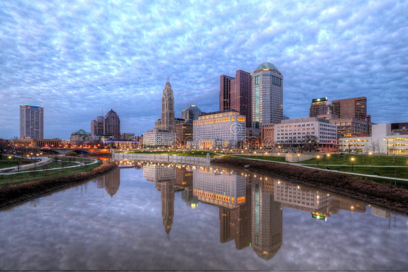 Evening Columbus Ohio skyline with thousands of clouds along the Scioto River at dusk. Evening Columbus Ohio skyline with thousands of clouds along the Scioto River at dusk