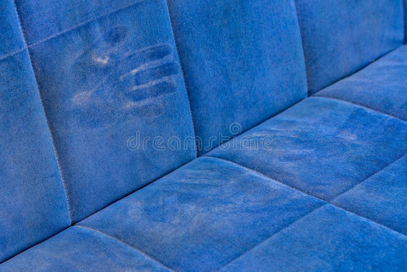 Dusty Blue Sofa Surface with Palm Prints Closeup with Selective Focus