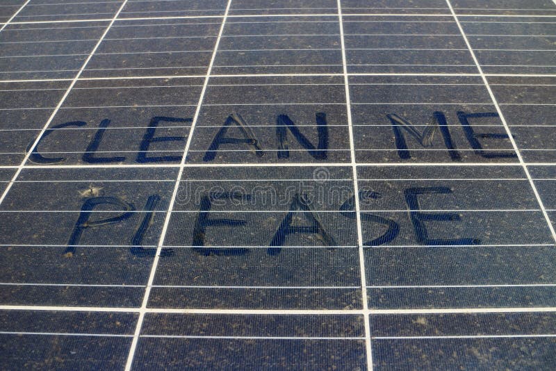 Dirty Dusty Solar Panels with Hand Writing Text CLEAN ME PLEASE. Dirty Dusty Solar Panels with Hand Writing Text CLEAN ME PLEASE