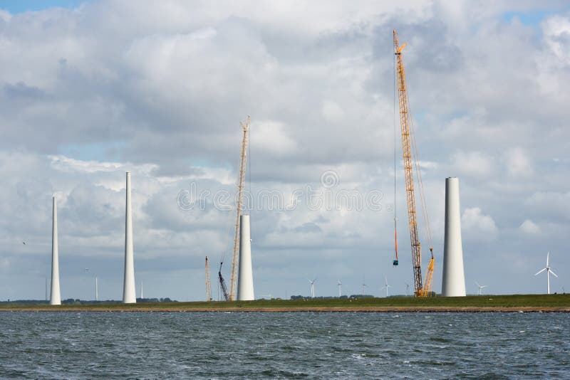 Dutch construction site building wind turbines seen from the sea