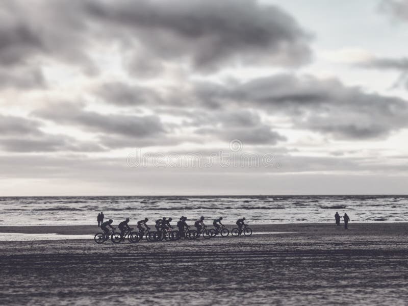 Dutch cyclists rack up miles on the beaches of Haarlem - HOLLAND stock photo