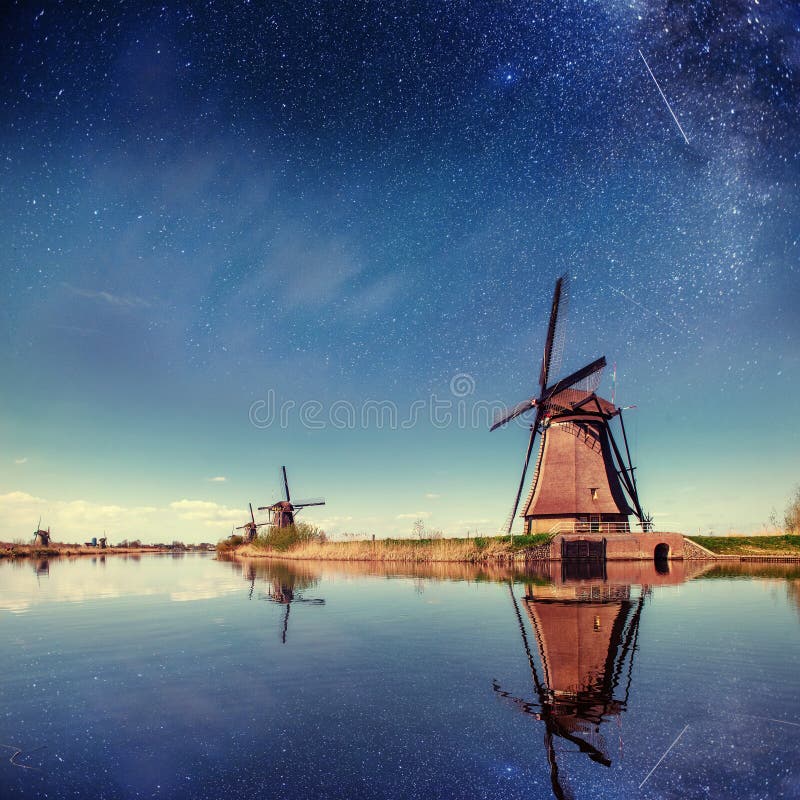 Dutch mill at night. Starry sky. Holland Netherlands. stock photography