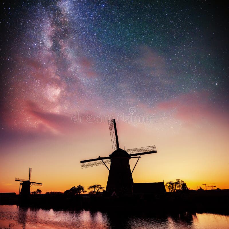 Dutch mill at night. Starry sky. Holland. Netherlands royalty free stock photo