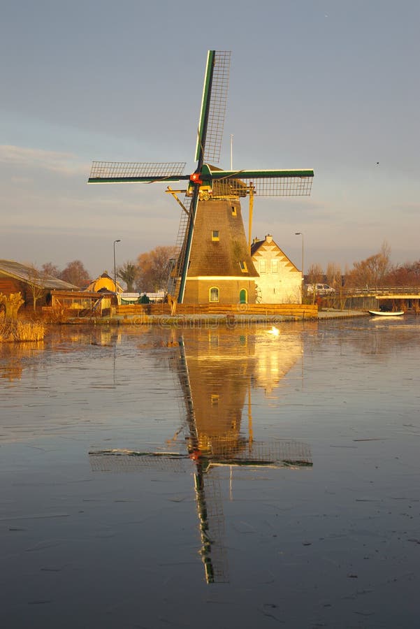 Dutch Mill reflection in Holland in winter.