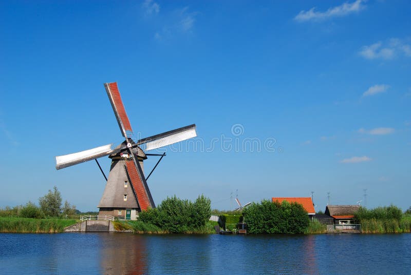 Dutch mill on the waterside stock photos