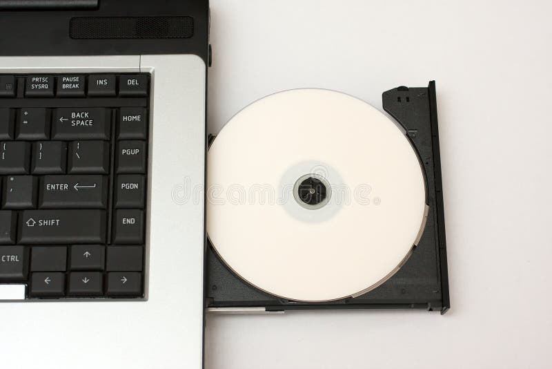 DVD or CD being loaded into laptop