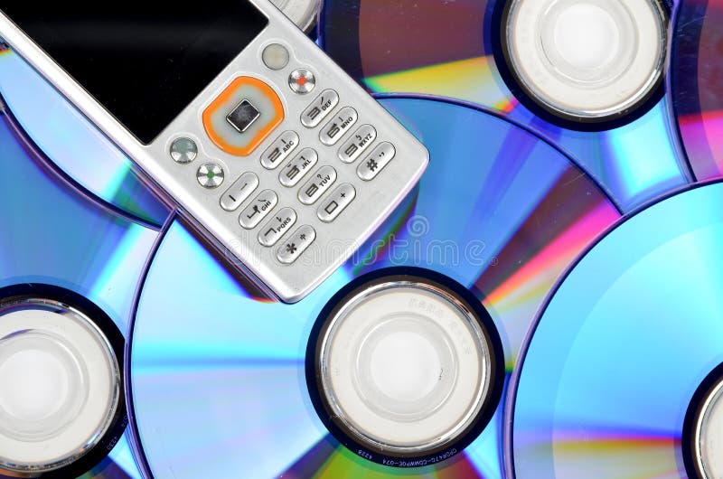 DVD and mobile phone stock photo. Image of digital, messaging 23566924