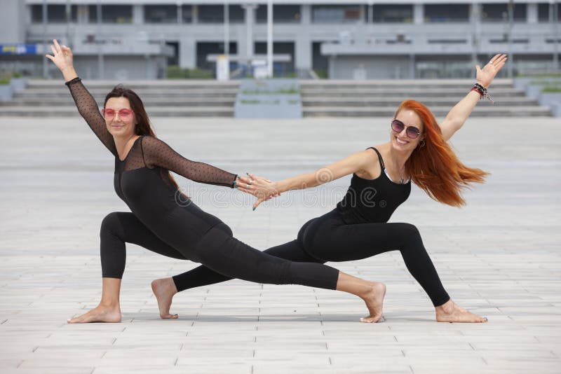 Two mature women keeping fit by doing yoga in the summer. Portrait. Two mature women keeping fit by doing yoga in the summer. Portrait