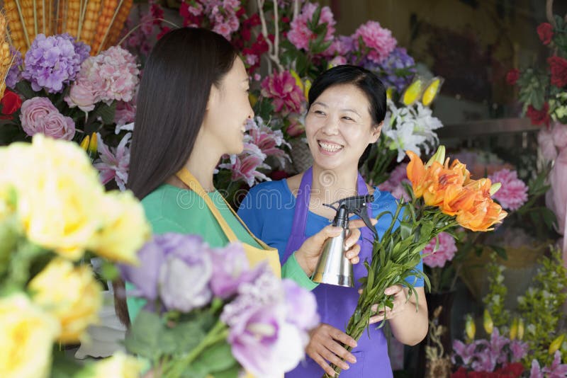 Two Mature Women Working In Flower Shop. Two Mature Women Working In Flower Shop
