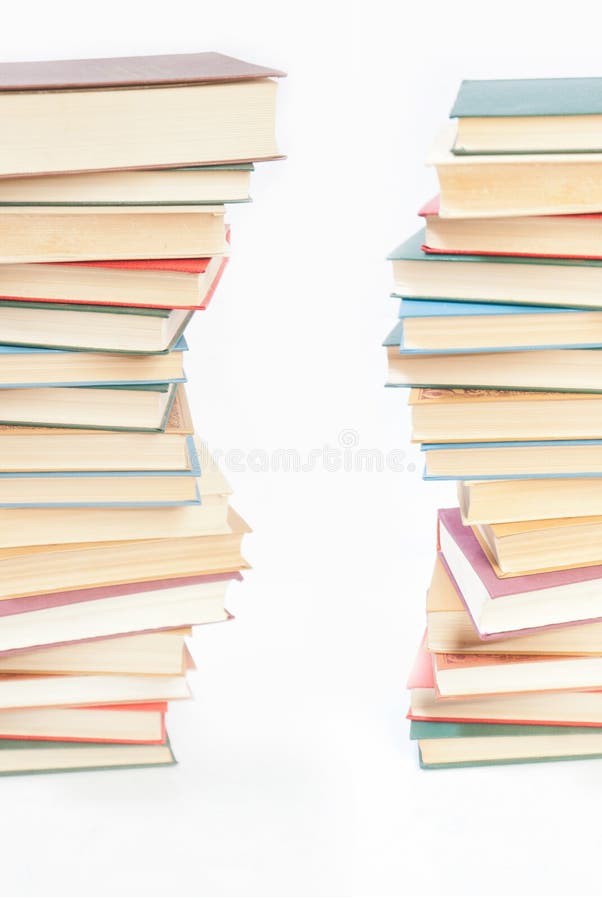 Two towers of books on white background. Two towers of books on white background