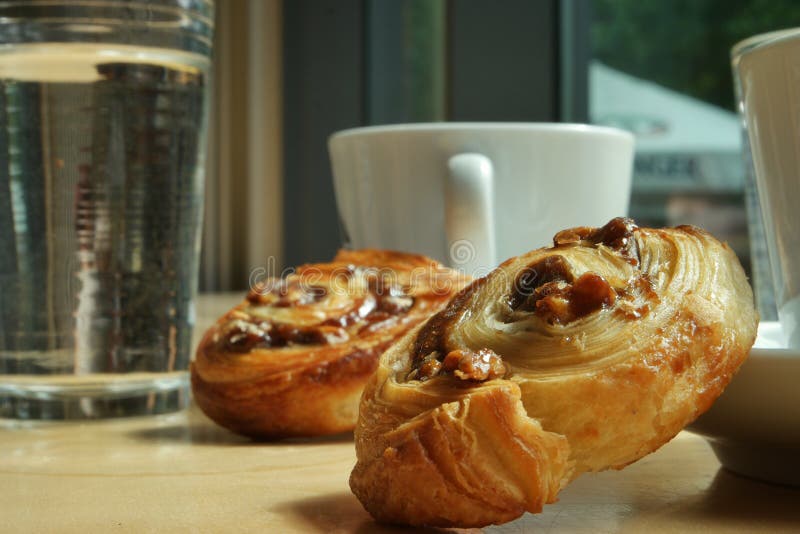 Having coffee and a little sweet at the bakery in the market hall. Having coffee and a little sweet at the bakery in the market hall