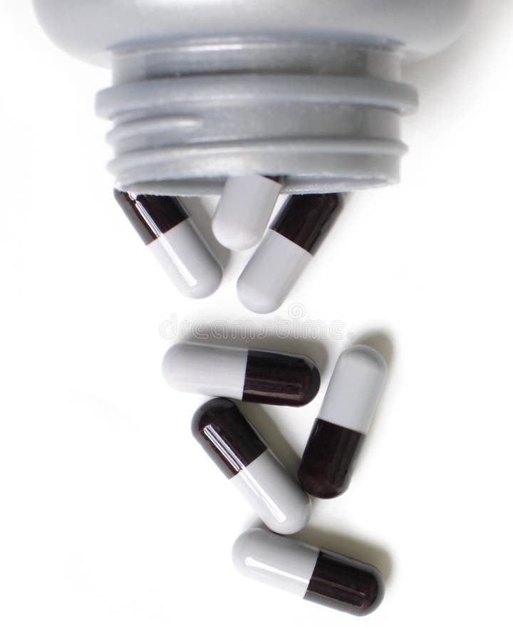 Pills and bottle on a white background. Pills and bottle on a white background