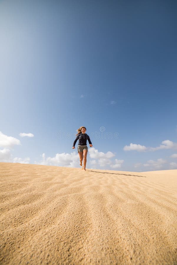 Cute Girl Running and Jumping in the Sand Dunes Stock Photo - Image of ...