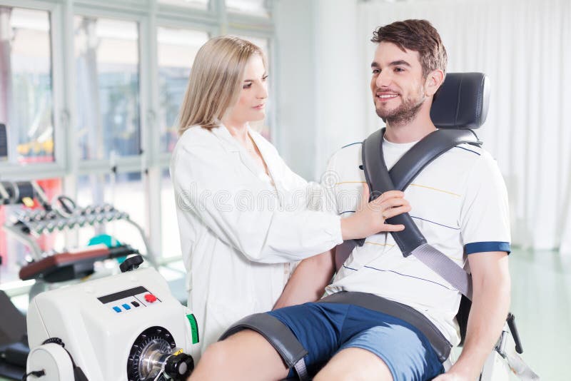 Dynamometer test for rehabilitative capability. Male patient on a Isokinetic testing machine for check the function of his knee stock photos Dynamometer test for rehabilitative capability. Male patient on a Isokinetic testing machine for check the function of his knee stock photos