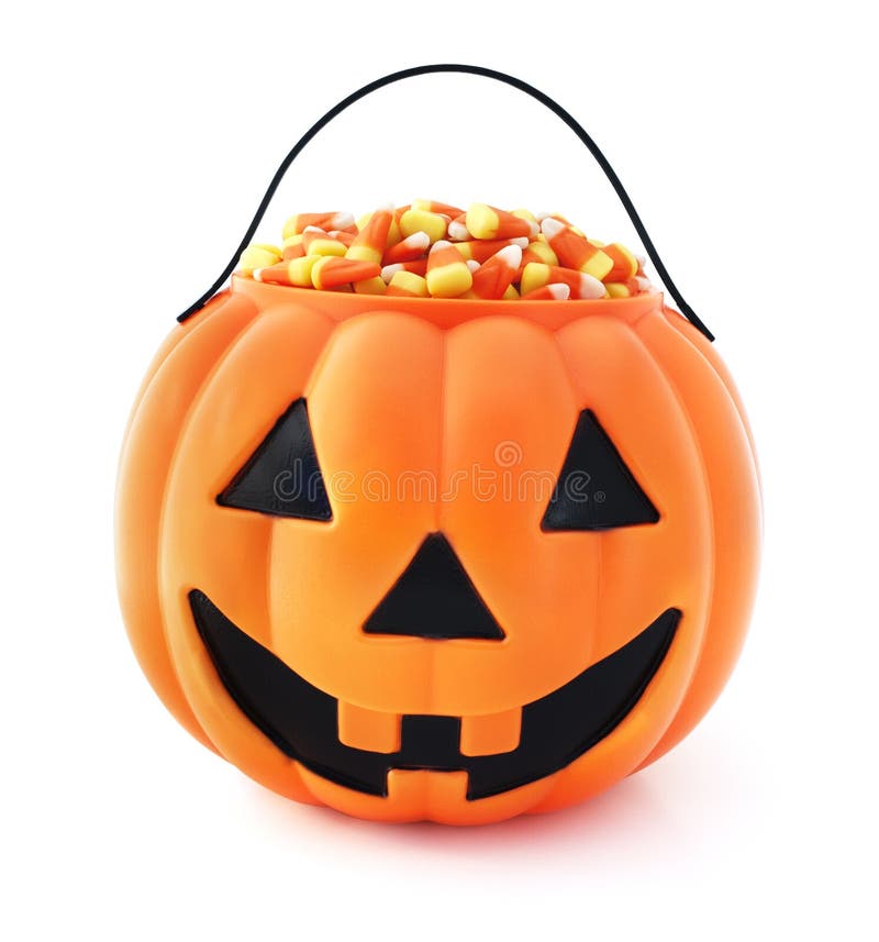 Isolated pumpkin Jack-o-lantern filled with candy corn. Isolated pumpkin Jack-o-lantern filled with candy corn.